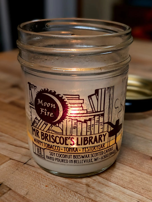 'Moonfire' brand 'Mr. Briscoe's LIbrary' scented candle with a book themed label.