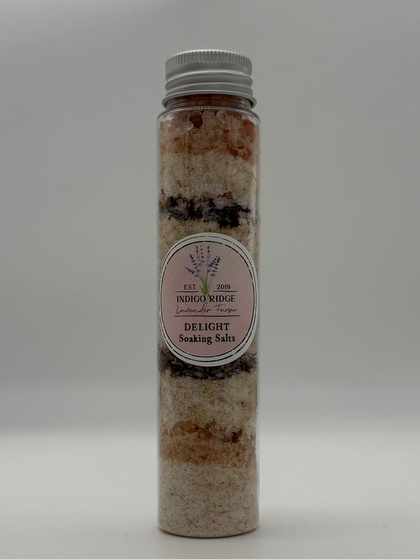 Bottle of Indigo Ridge Delight Soaking Salts on a white background