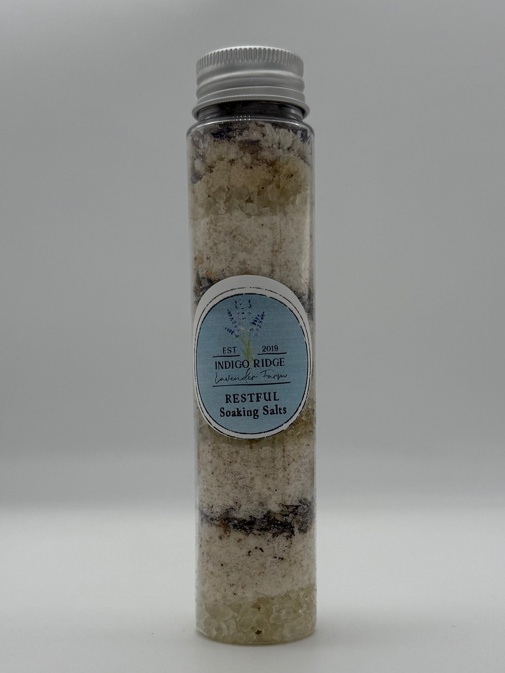 Bottle of Indigo Ridge Restful Soaking Salts on a white background