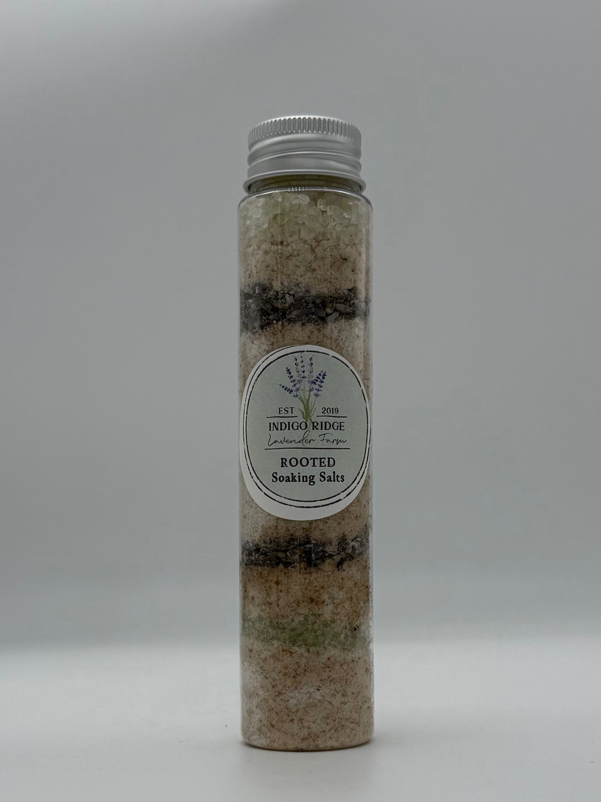 Tube of Indigo Ridge Rooted Soaking Salts with a label on a white background
