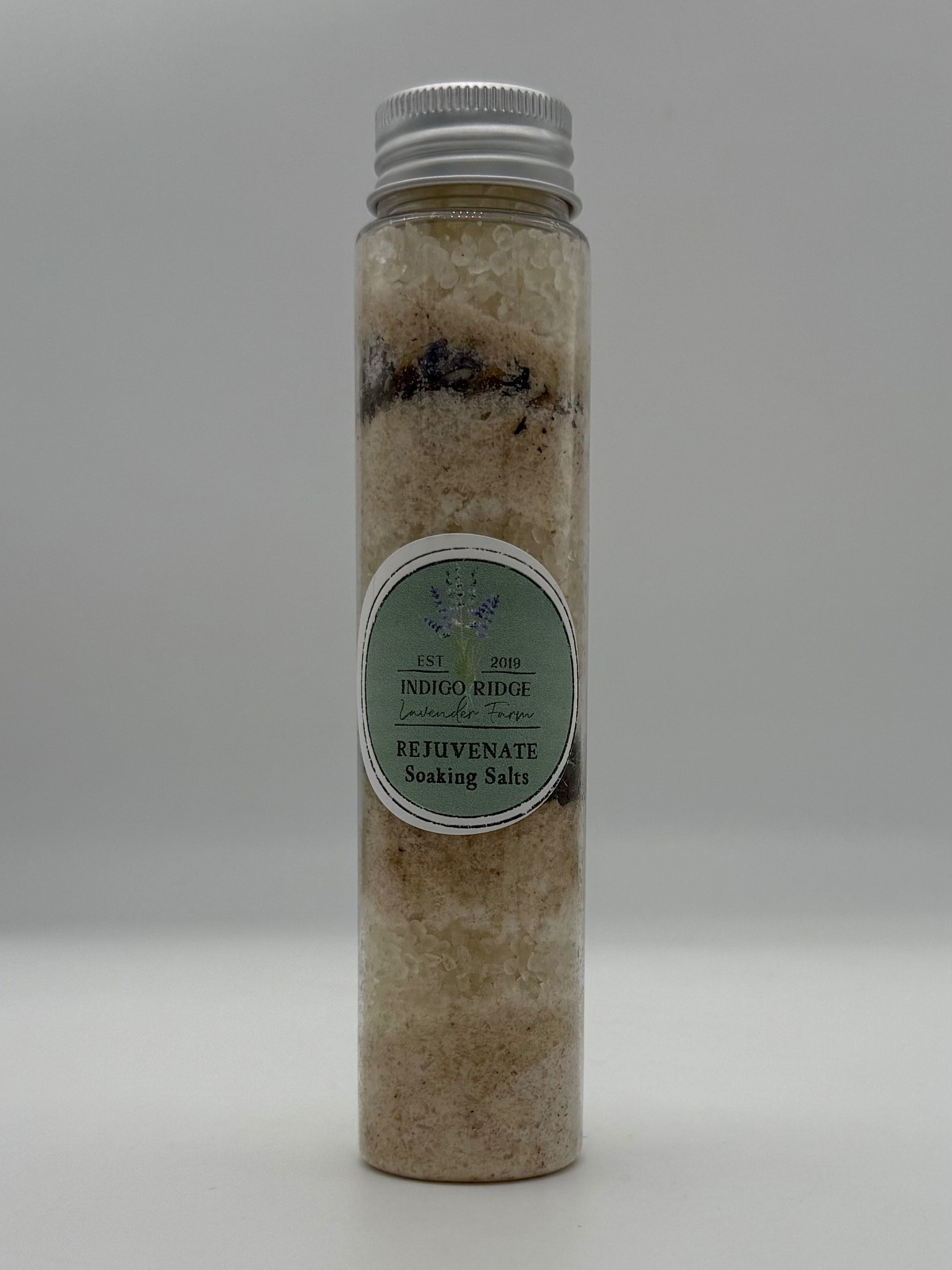 Tube of Indigo Ridge Rejuvenate Soaking Salts with a label on a white background