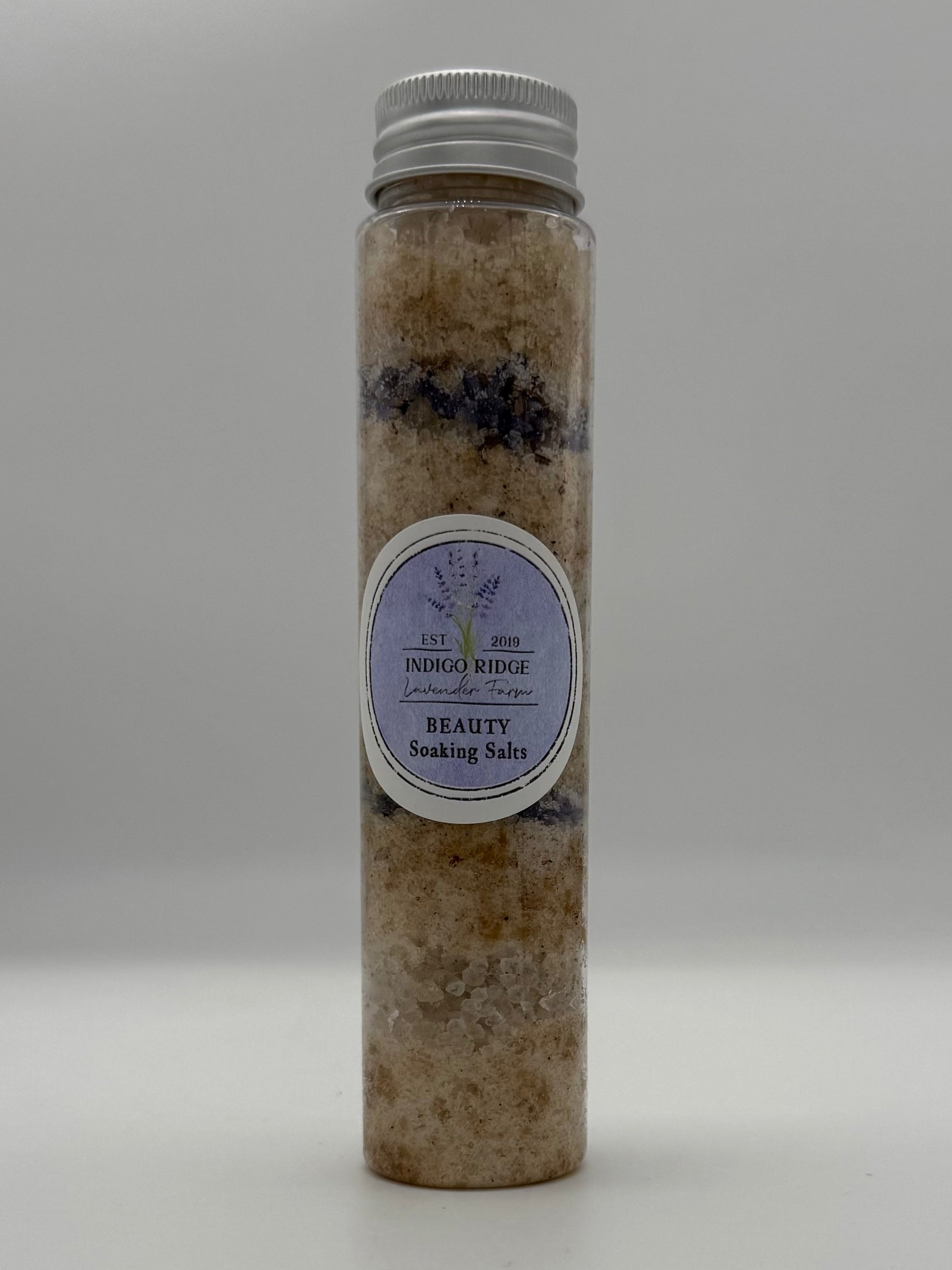 Tube of Indigo Ridge Beauty Soaking Salts with a label on a white background